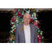 Arkansas State Representative Jack Fortner stands smiling in front of the Christmas tree. 
