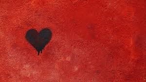 small black heart on a red background