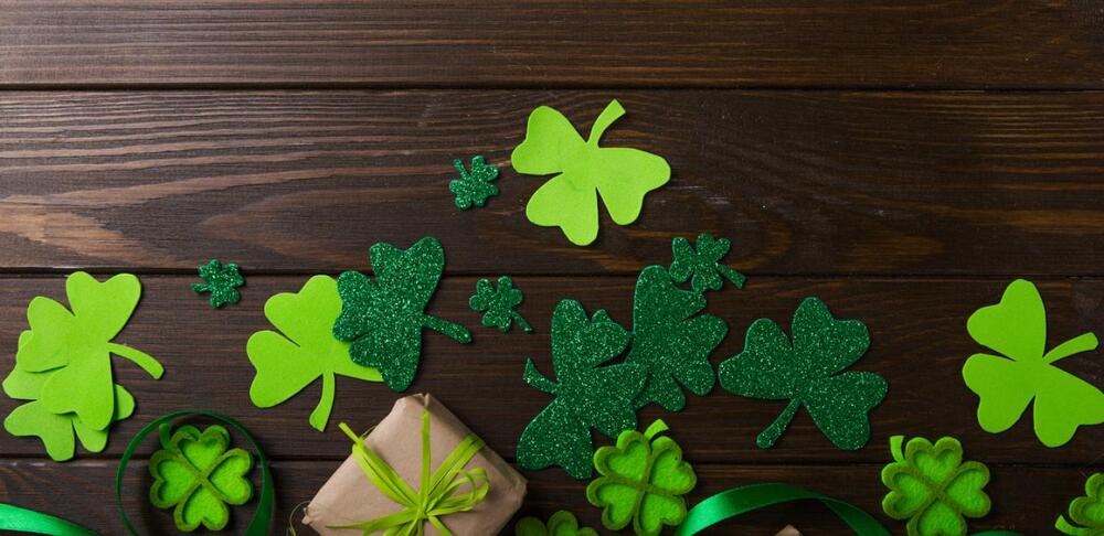 bright green shamrocks on wooden wall