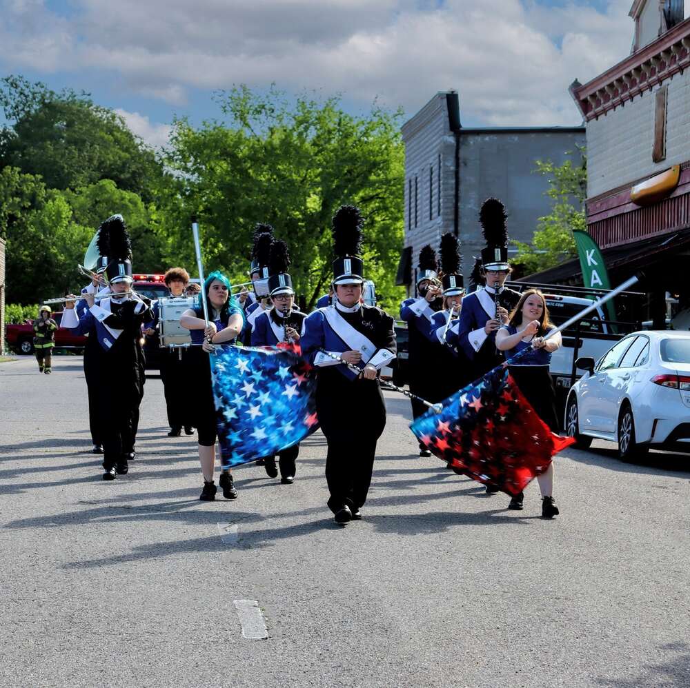 Cotter Warrior band marching down the street in Downtown Cotter