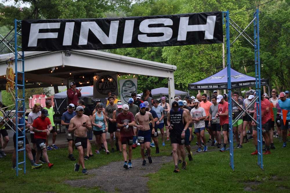 runners crossing a finish line