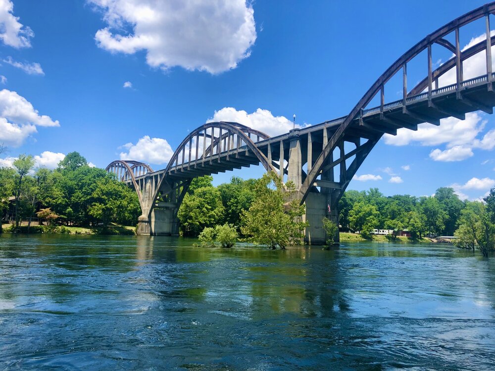 Cotter Bridge and blue water with sky