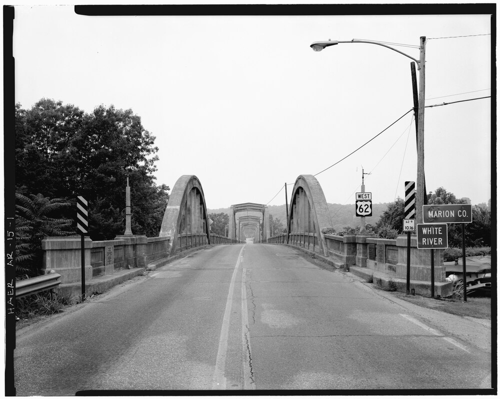 Looking Northwest, general view of concrete spandrel arch, bridge from roadbed - Cotter Bridge, spanning White River at U.S. Highway 62, Cotter, Baxter County, AR.