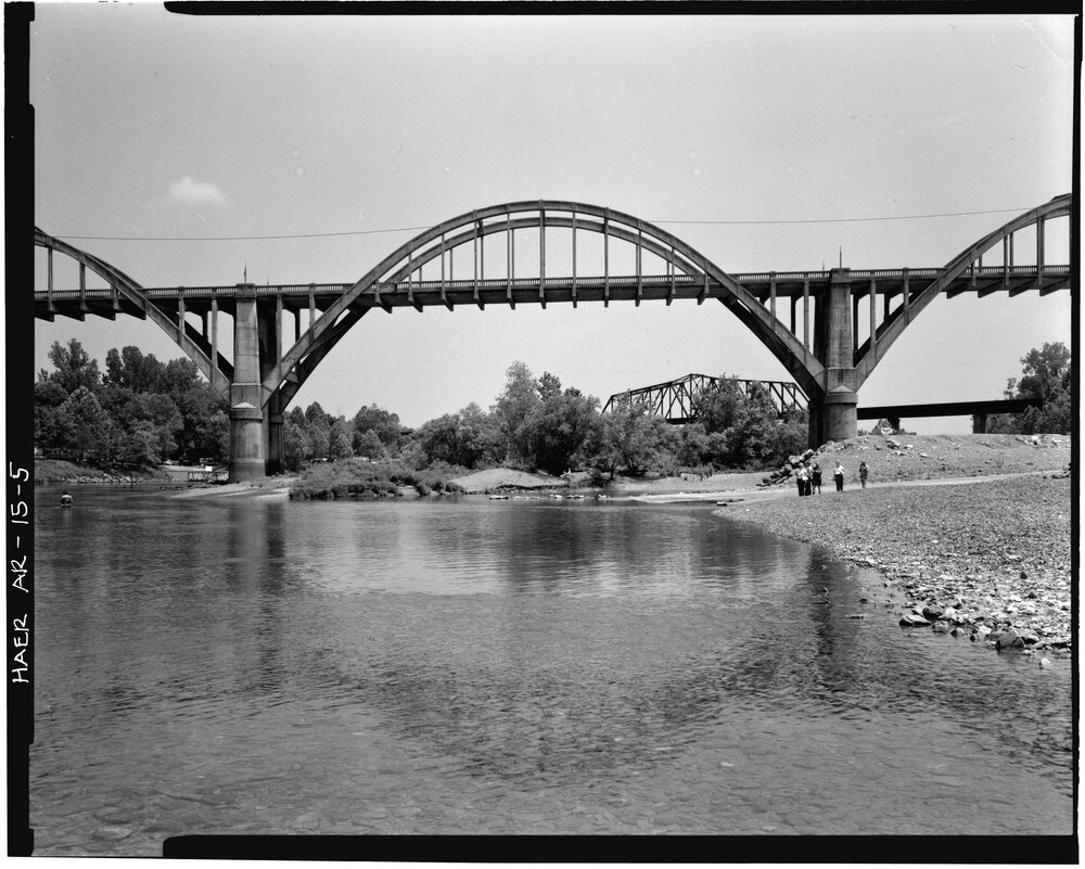 View of center span of bridge from riverbed, looking Southwest - Cotter Bridge, Spanning White River at U.S. Highway 62, Cotter, Baxter County, AR.