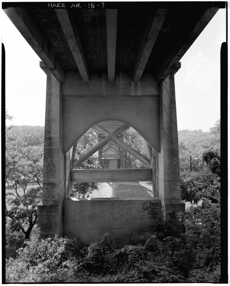 View of bridge from underneath showing concrete pier and concrete deck supporting system, looking Northwest - Cotter Bridge, spanning White River at U.S. Highway 62, Cotter, Baxter County, AR.