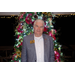 Arkansas State Representative Jack Fortner stands smiling in front of the Christmas tree.