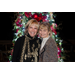 Karen Montgomery and Jan Peitz stand together, smiling in front of the tree.
