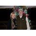 Mayor Mac Caradine and Karen Montgomery stand together, smiling in front of the Christmas tree.