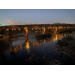 Cotter Bridge lit up in amber tones; the photo was taken by Ray Theobold